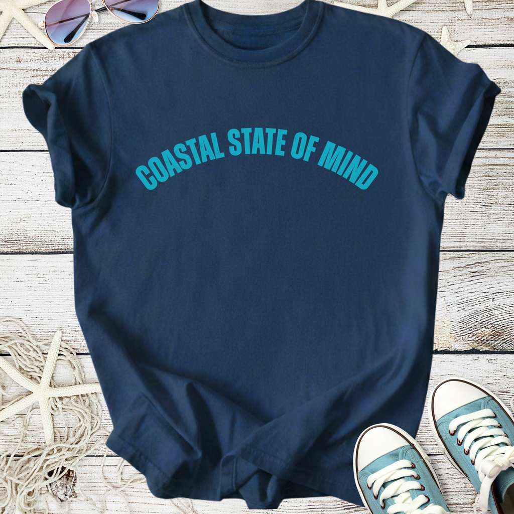 Navy blue t-shirt with 'Coastal State of Mind' graphic, perfect for casual beachwear.